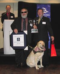 Photo 15.	Paul Borg  2005 Victorian Sailor of the Year with a Disability with Yachting Victoria President, John Burgess, and Hugh.