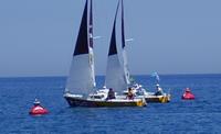 Photo 8.	Italy and Israel enter the start between the two leeward acoustic buoys.